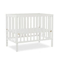 Edgewood 4-In-1 Convertible Mini Crib In White, JPMA Certified, Non-Toxic Finish, New Zealand Pinewood, With 3 Mattress Height Settings, Included 1" Mattress Pad