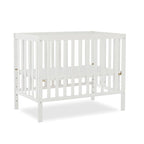 Edgewood 4-In-1 Convertible Mini Crib In White, JPMA Certified, Non-Toxic Finish, New Zealand Pinewood, With 3 Mattress Height Settings, Included 1" Mattress Pad