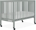Quinn Full-Size Folding Crib in Cool Grey, Removeable Wheels, Modern Nursey, Adjustable Mattress Support, Portable Crib, Patented Folding System