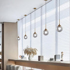 KCO Lighting 2 Pack Brass Gold Small 7.1” Smoky Glass Globe Pendant Lights | E26 Adjustable Cord for Sloped Ceilings, Mid Century Modern Gold Hanging Light Fixture for Kitchen Island Sink Dining Table