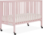 Quinn Full-Size Folding Crib in Blush Pink, Removeable Wheels, Modern Nursey, Adjustable Mattress Support, Portable Crib, Patented Folding System