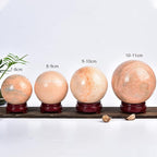 JIC Gem Big Sparkling Quartz Crystal Ball Sunstone Healing Crystal Gemstone Sphere with Decorative Wooden Stand for Meditation Gifts Decoration (80-90mm)