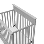 STORKCRAFT Petal 4-in-1 Convertible Mini Crib (Pebble Gray) – GREENGUARD Gold Certified, Converts to Daybed and Twin-Size Bed, Includes Bonus 2.75-inch Mini Crib Mattress