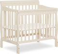 Aden 4-in-1 Convertible Mini Crib In French White, Greenguard Gold Certified, Non-Toxic Finish, New Zealand Pinewood, With 3 Mattress Height Settings