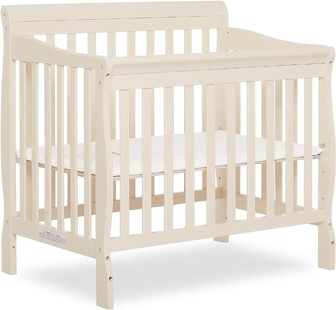Aden 4-in-1 Convertible Mini Crib In French White, Greenguard Gold Certified, Non-Toxic Finish, New Zealand Pinewood, With 3 Mattress Height Settings