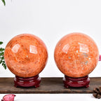 JIC Gem Natural Sunstone Sphere Ball with Wooden Stand for Fengshui Rare Healing Crystal Decoation Meditation Energy Reiki (90-100mm)