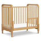 DaVinci Jenny Lind 3-in-1 Convertible Mini Crib in Honey, Removable Wheels, Greenguard Gold Certified
