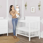 Ava 4-in-1 Convertible Mini Crib in White, Greenguard Gold Certified, Non-Toxic Finish, Comes with 1" Mattress Pad, with 3 Mattress Height Settings